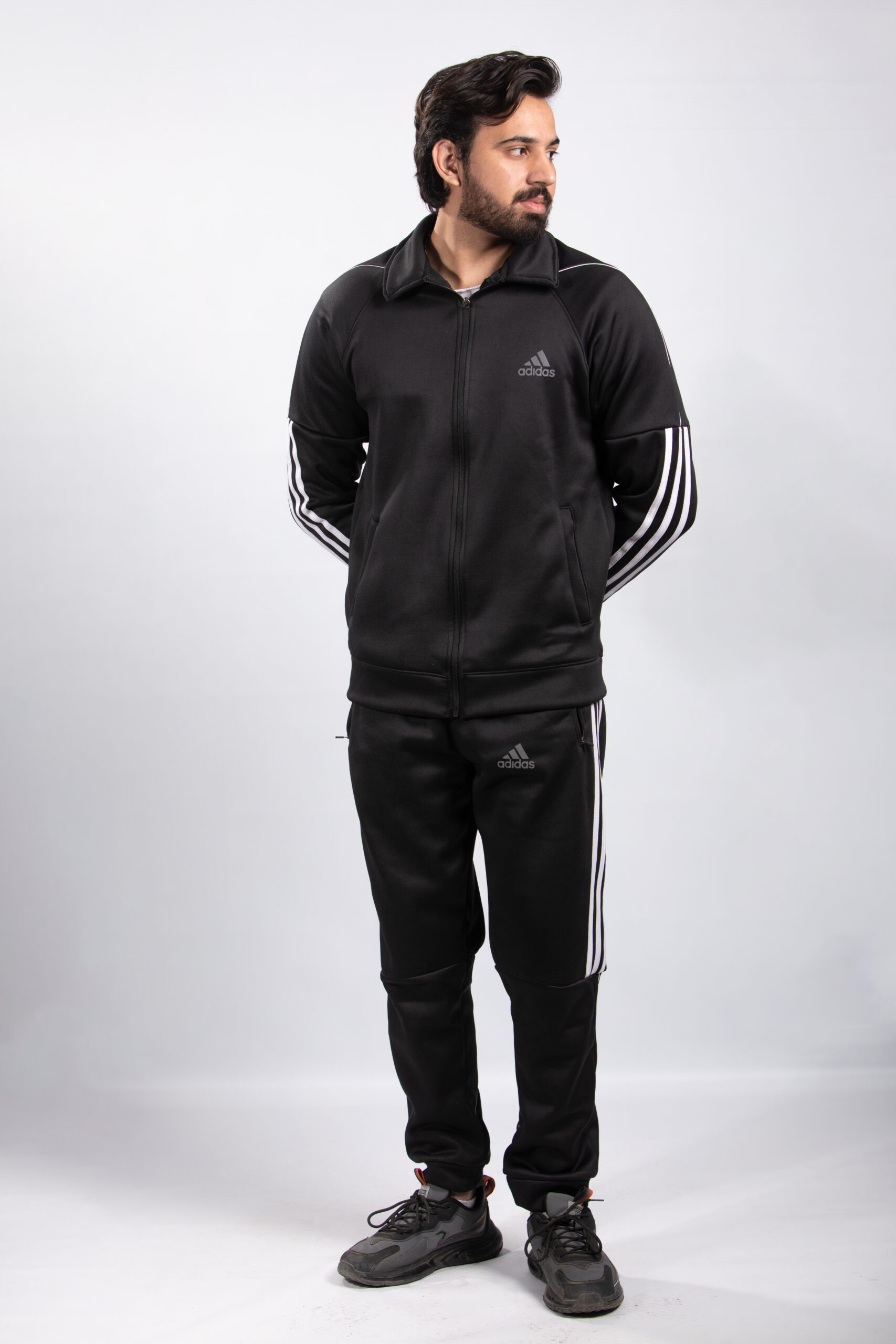 model wearing black tracksuit in pakistan