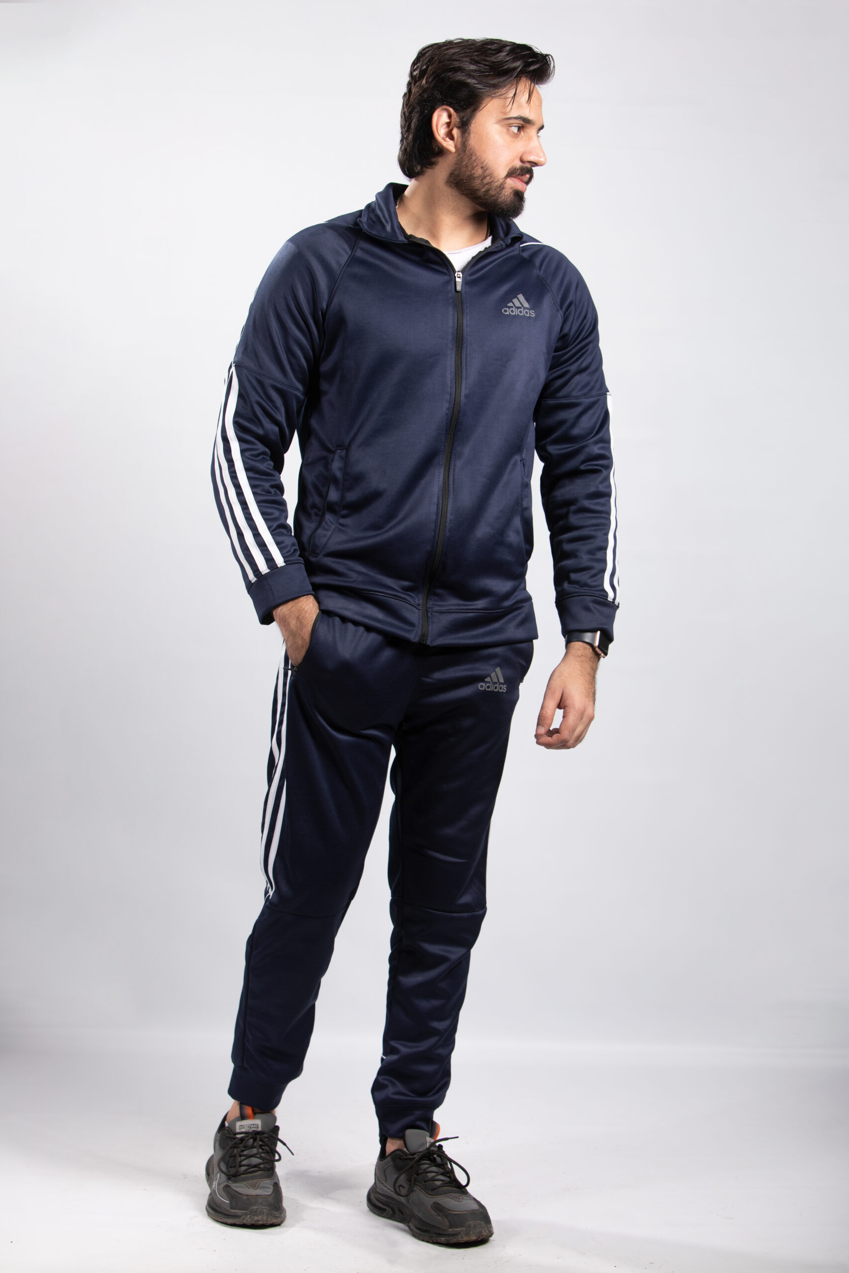 model wearing blue tracksuit