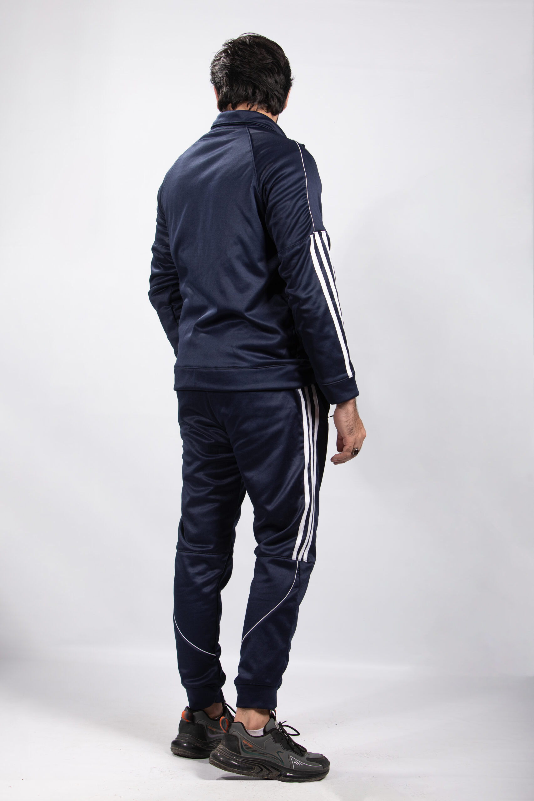 model wearing blue tracksuit back